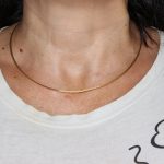 Collana oro giallo tre fili rigidi satinati